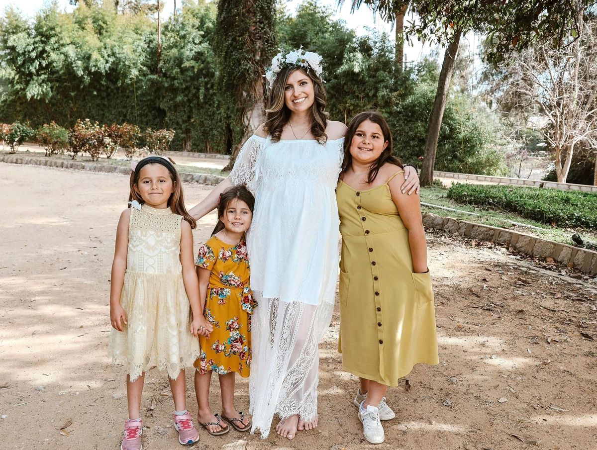 Megan Agnew, founder of Mentoring Our Moments, with family