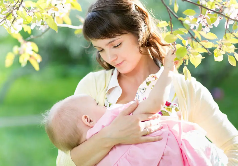 A mother holding her baby