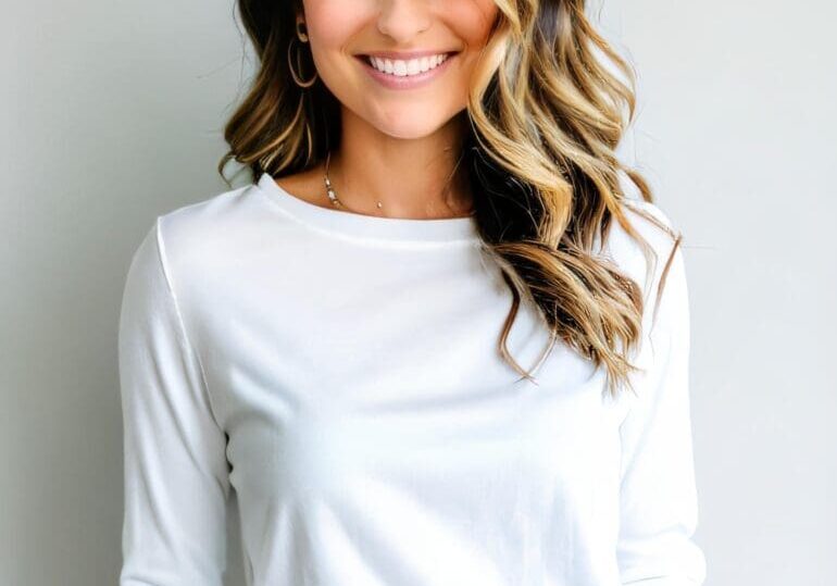 A woman with long hair wearing white shirt