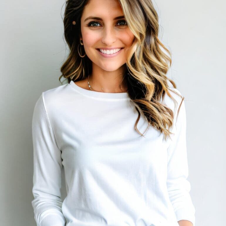 A woman with long hair wearing white shirt